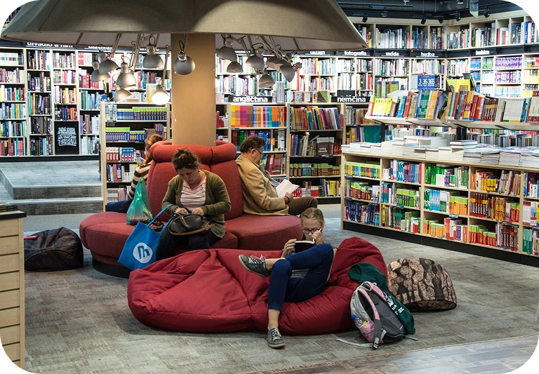 Students reading on beanbags in a bookstore