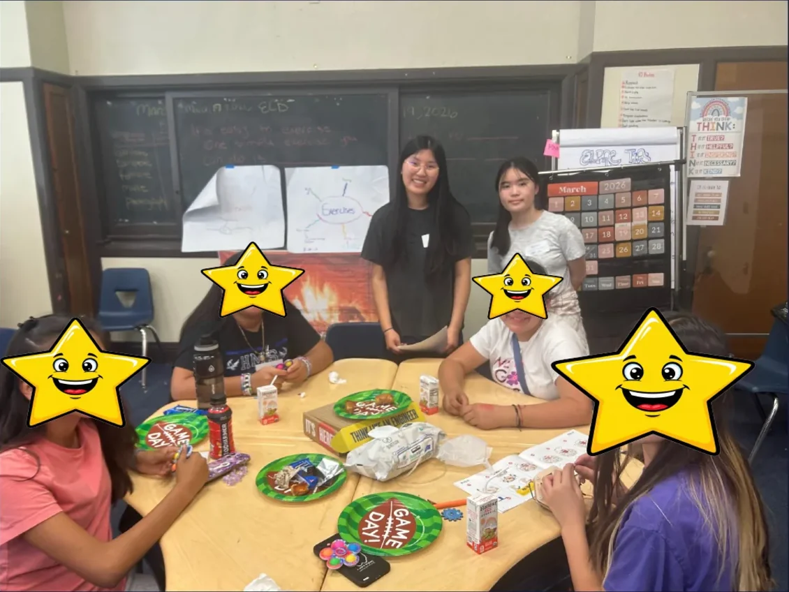 Crunch Club 2026 students sharing snacks and builds around a table