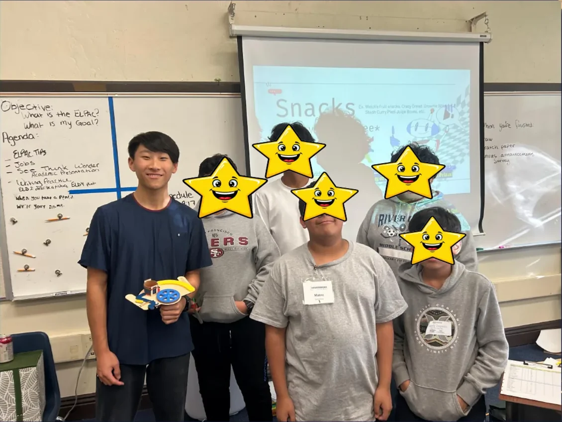 Crunch Club coaches and students with their completed builds